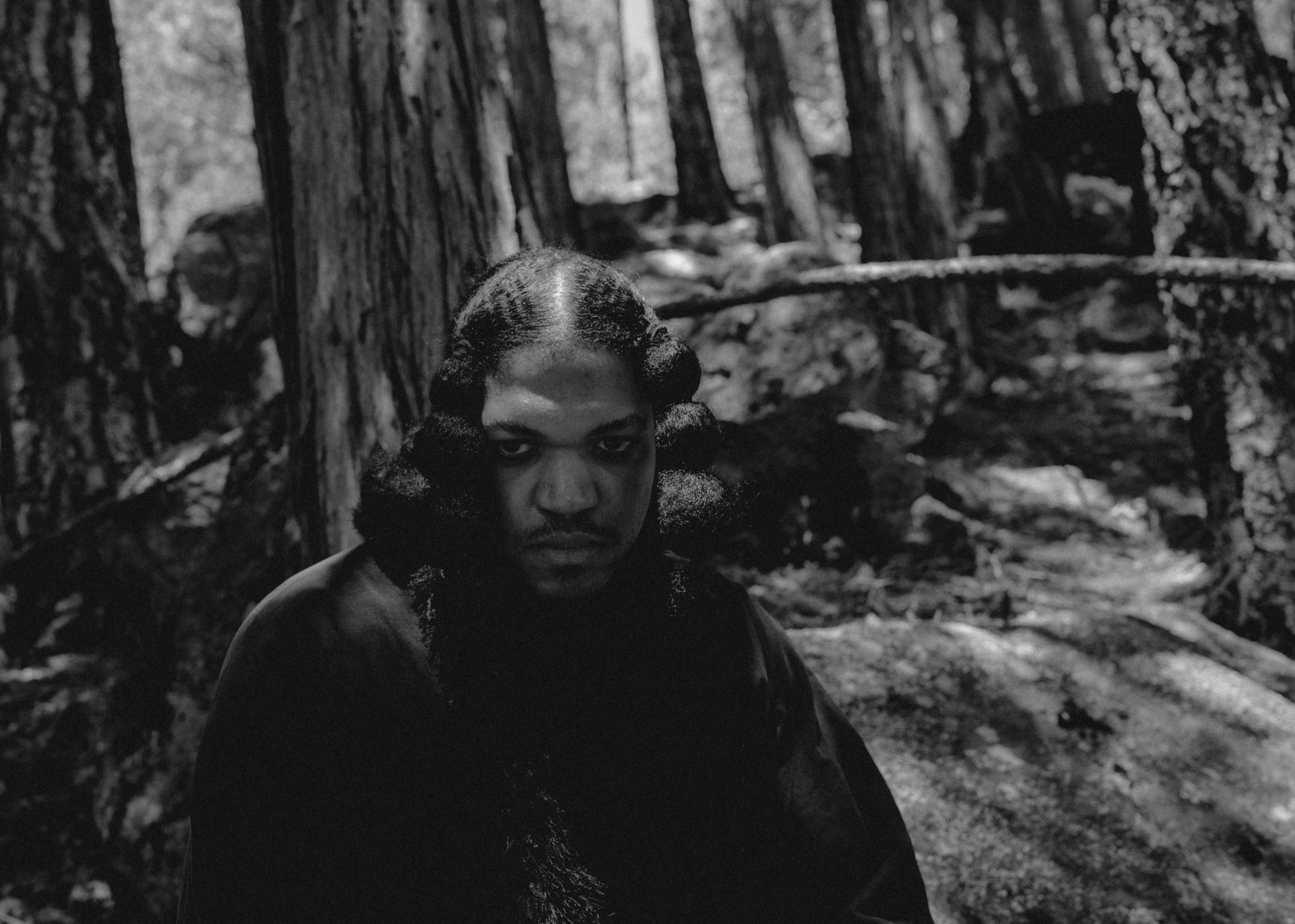 Leo Pastel with raised hand in outdoor setting